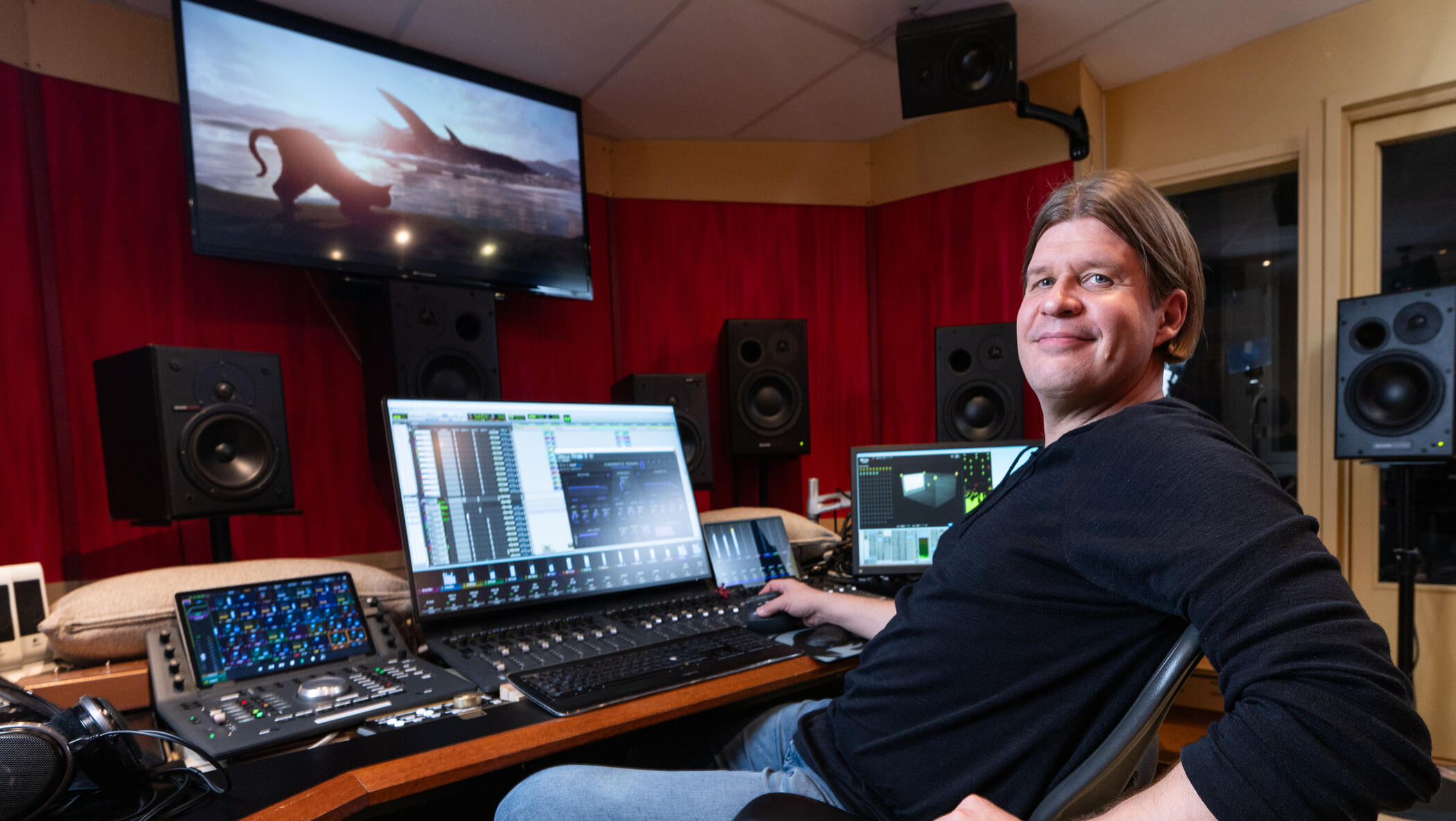 Mikko Raita mixing the Best Animated Feature Oscar-winning film Flow score at his Dolby Atmos music mixing control room in Studio Kekkonen, Helsinki - side pose